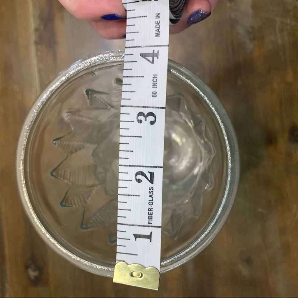 Clear glass floral vase with etched design